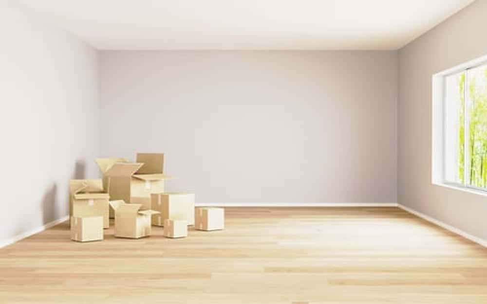 Bright empty room with moving boxes ready for a move-out deep clean