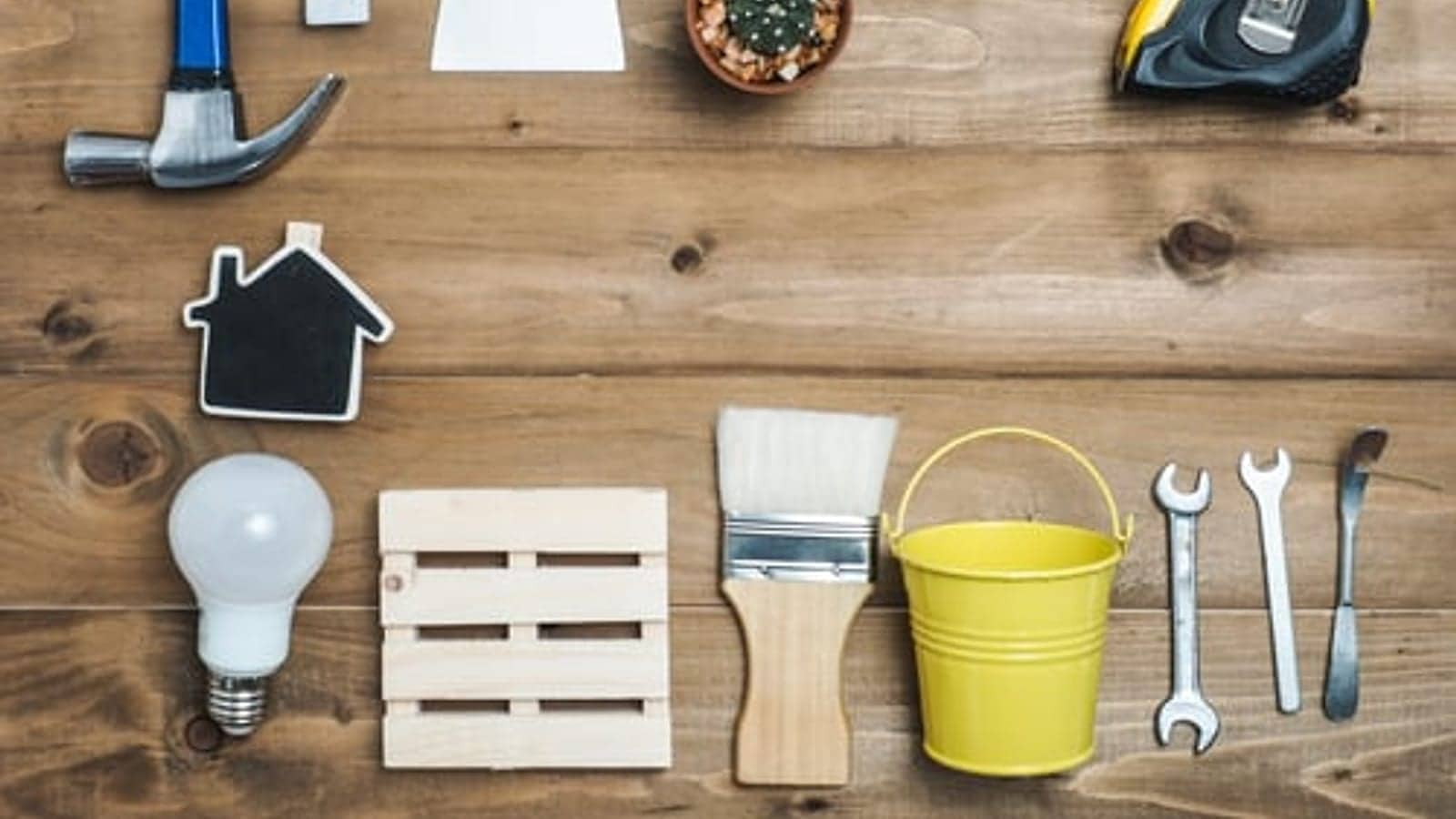 Home improvement tools laid out on a workbench, representing the SoHo Home Multiservices blog