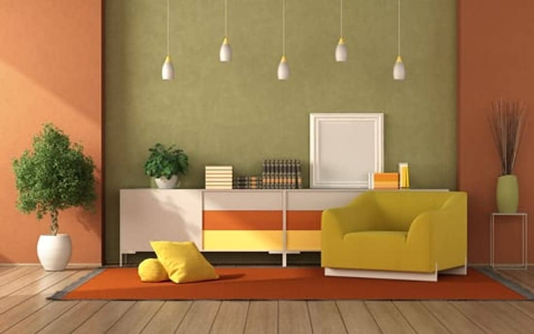 Freshly painted living room with warm coral accent walls by SoHo Home Multiservices in Sanford, Florida
